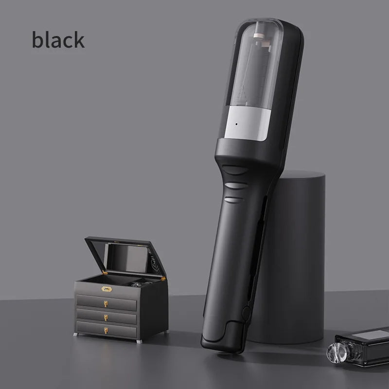 Black hair trimming device displayed upright beside a small jewelry box on a styled surface