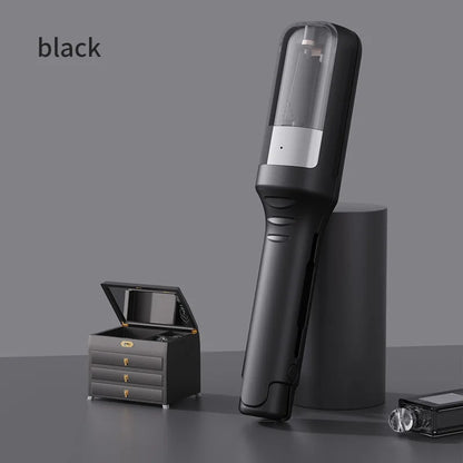 Black hair trimming device displayed upright beside a small jewelry box on a styled surface
