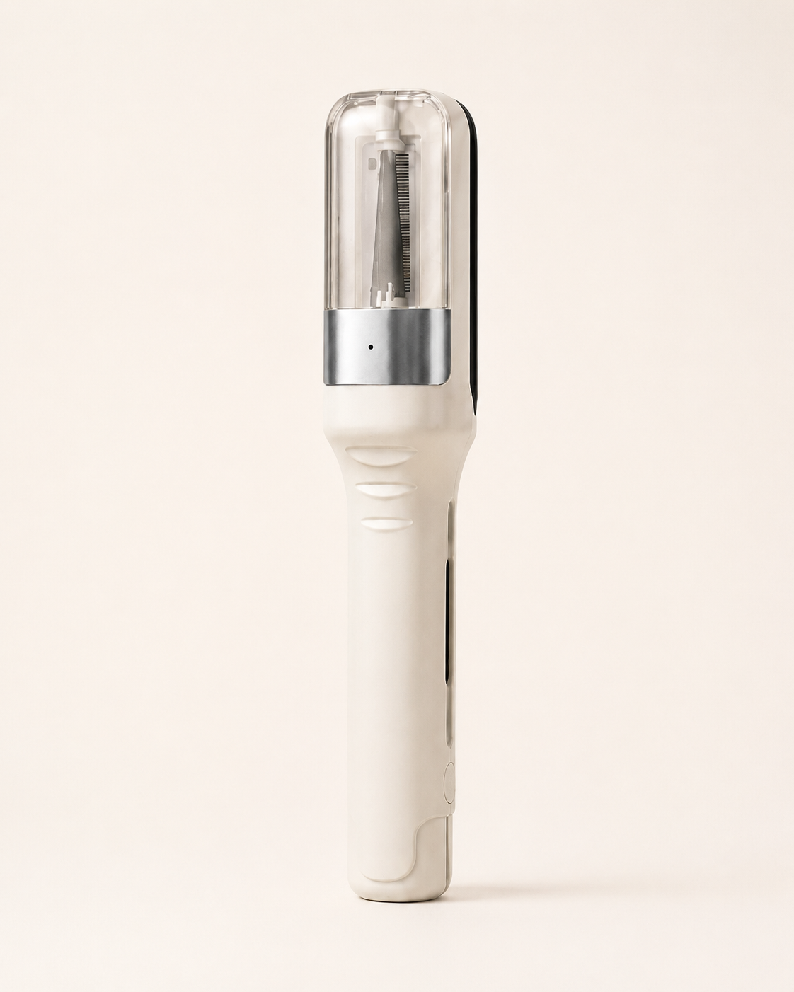 Off-white hair trimming device with transparent upper chamber and visible blade